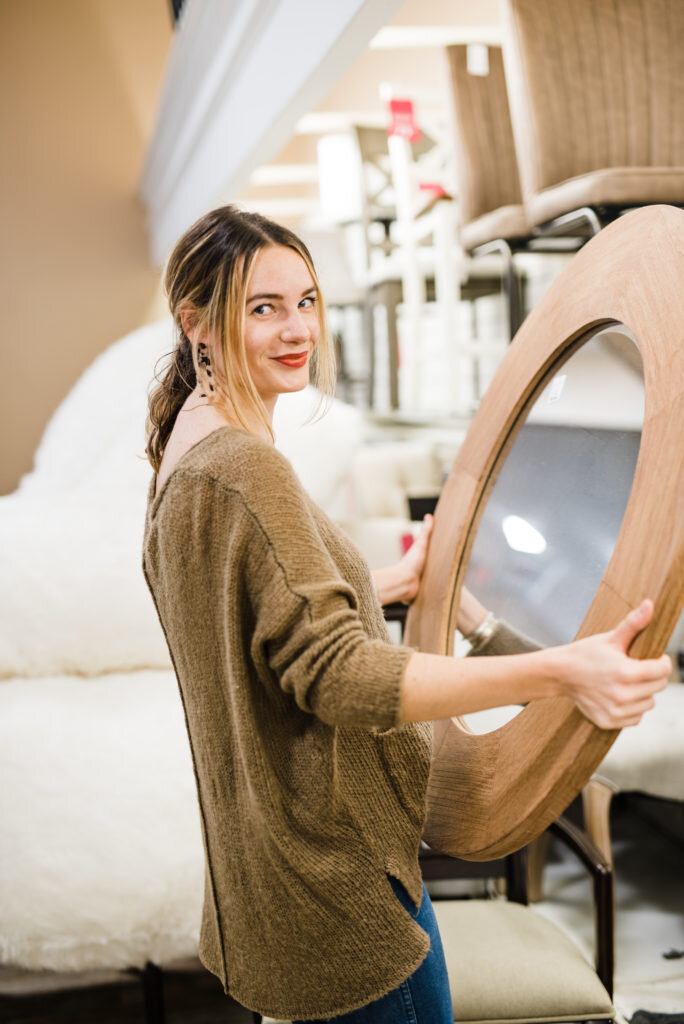 girl shopping holding mirror